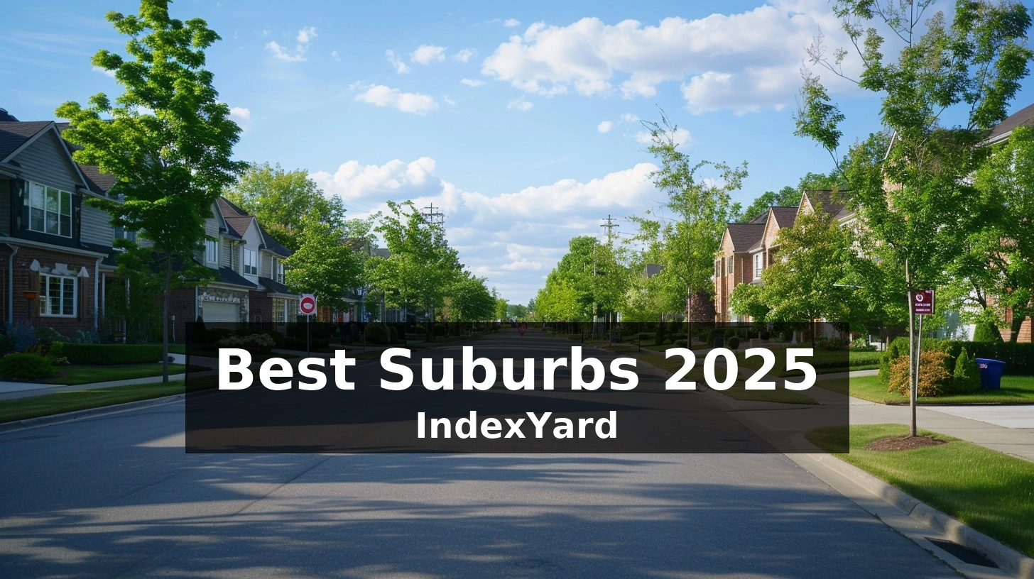 Tree-lined suburban neighborhood street with modern homes and sidewalks under a blue sky.